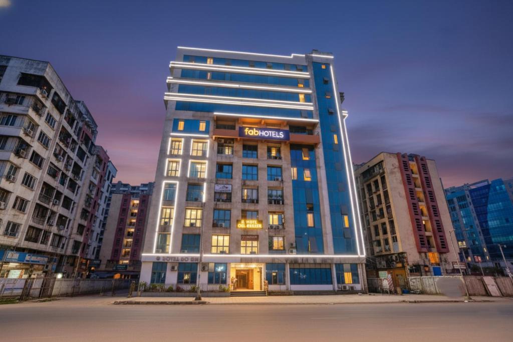 a tall building with a sign on top of it at FabExpress Diamond - Nr BKC in Mumbai