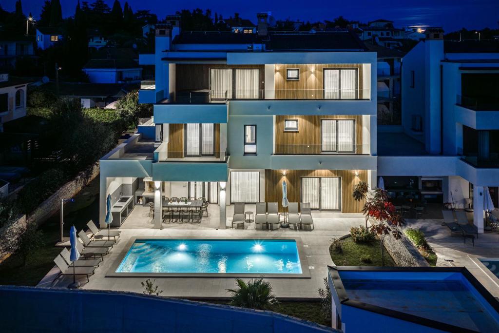 an aerial view of a house with a swimming pool at Luxury Villa del Sol in Premantura