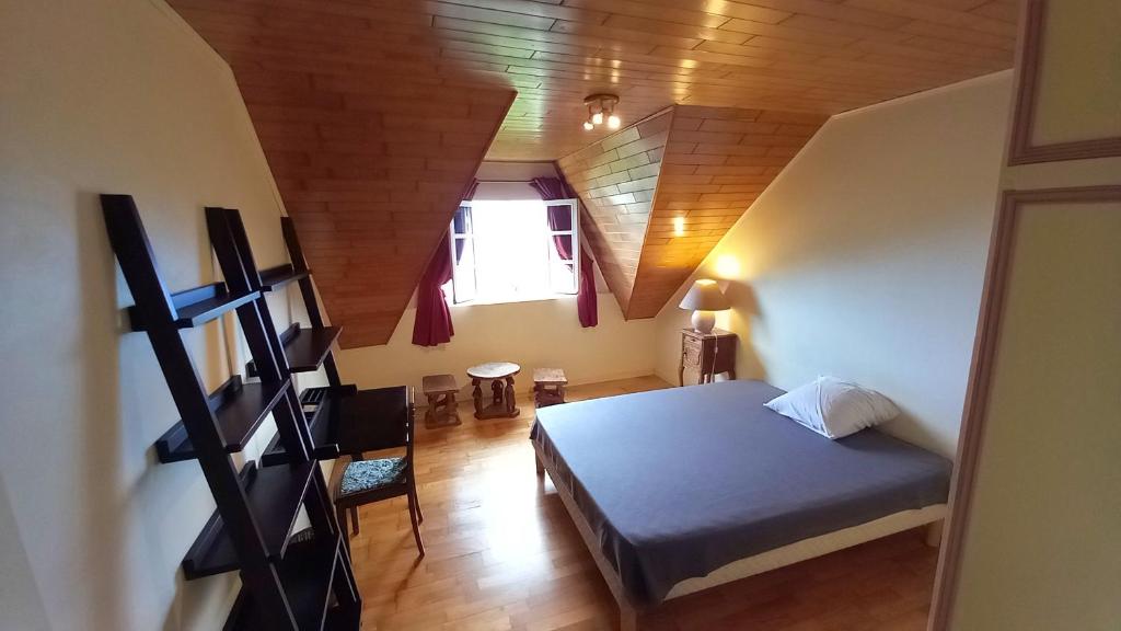 Postel nebo postele na pokoji v ubytování Chez Dominique