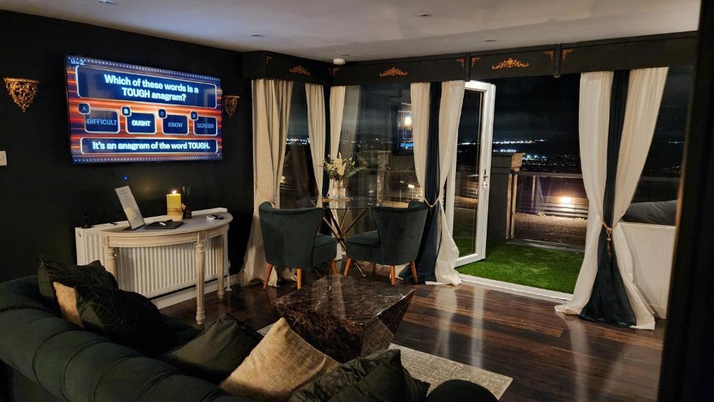 Χώρος καθιστικού στο Carberry Lodge