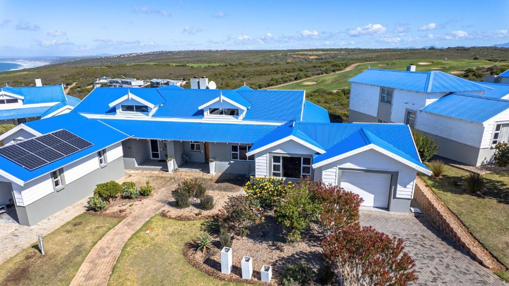 an aerial view of a house with blue roofs at La Vita Alti in Mossel Bay
