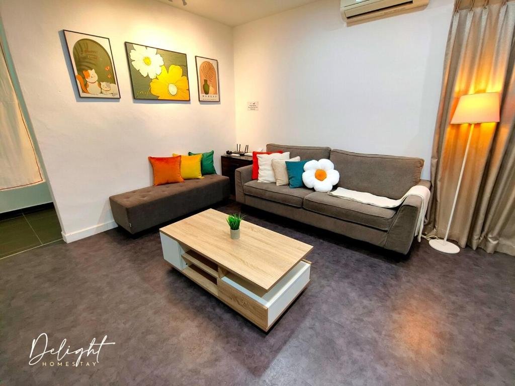 a living room with two couches and a coffee table at GD Corner Lot 10pax Water Dispenser BBQ Neflix Games in Masai