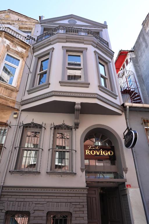 a large white building with a kovo sign on it at Rovigo Hotel in Istanbul