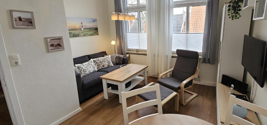 TV a/nebo společenská místnost v ubytování Hiddes Hus - Ferienwohnung Fuhrmann