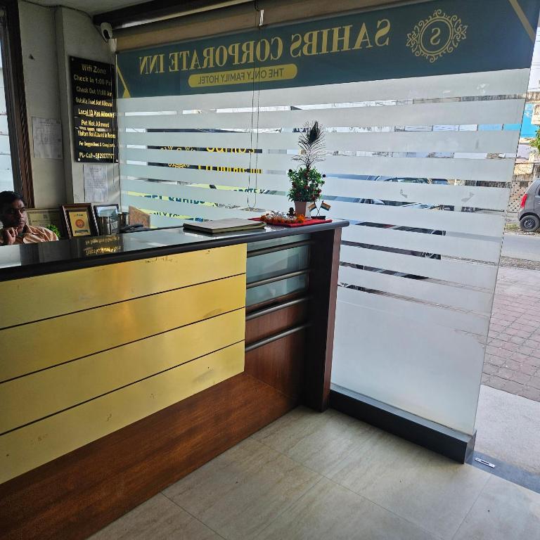 a counter in a restaurant with a counter sidx sidx sidx at Hotel Indra in Jaipur