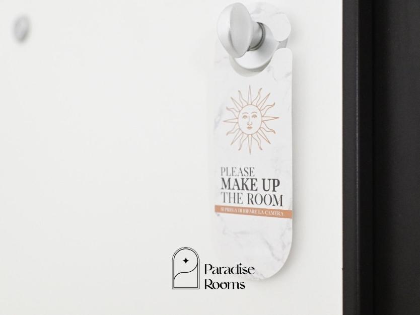a sticker on a door with a sign on it at Paradise Rooms in Bitritto