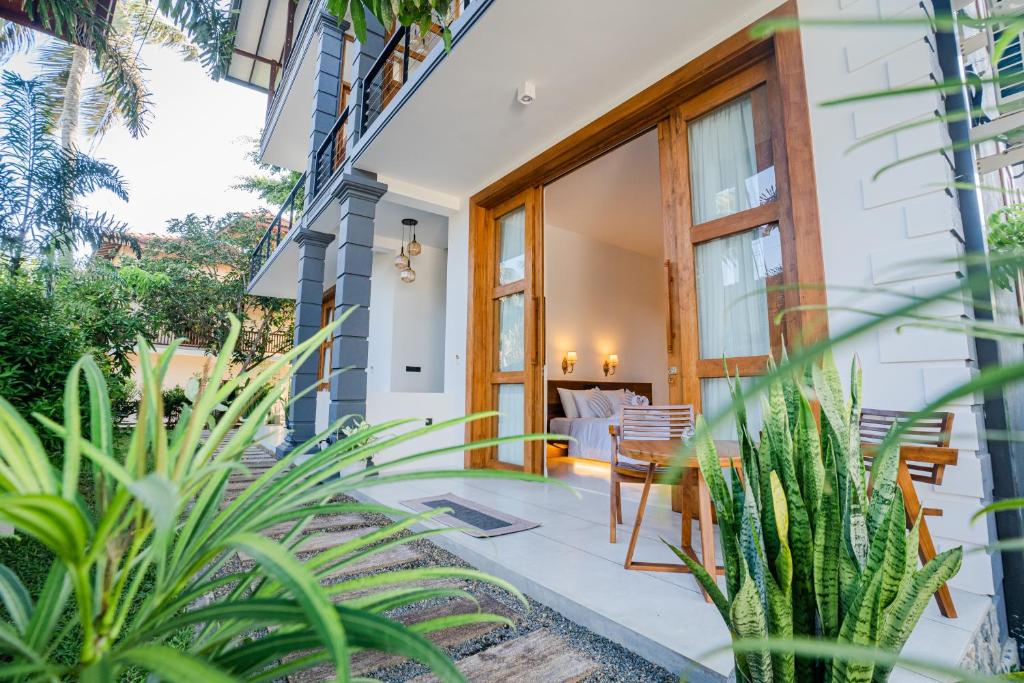 a home with a porch with a table and chairs at Madiha Venus in Matara