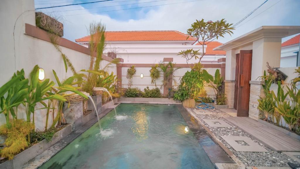 a small swimming pool in the backyard of a house at Villa Griya Anyar Ubud in Ubud