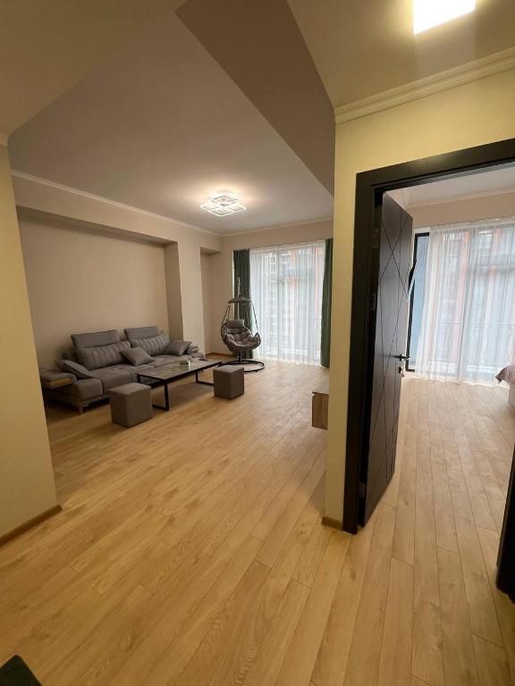 a living room with a couch and a table at Alvina complex in Tsaghkadzor