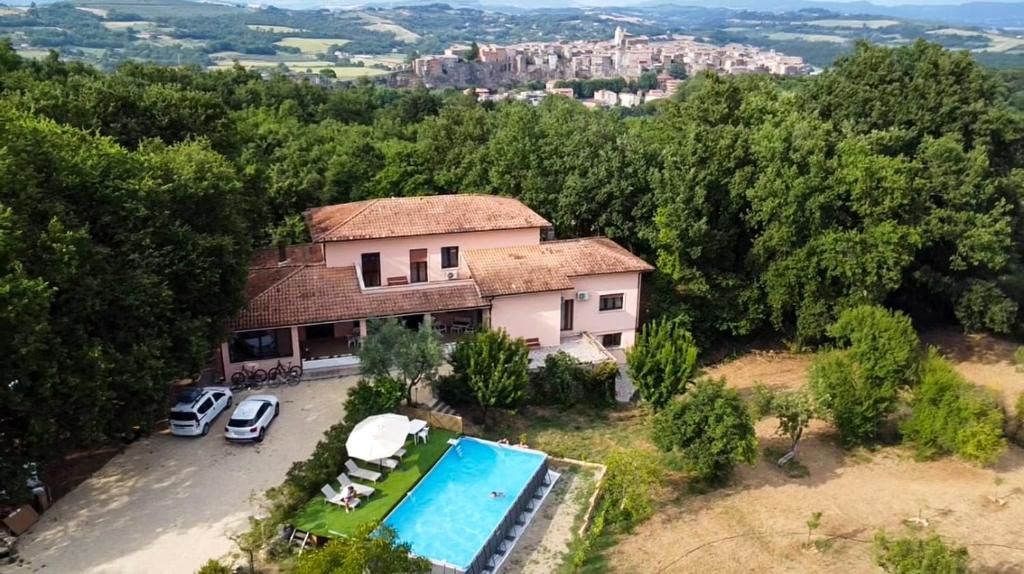 an aerial view of a house with a swimming pool at Villa with Garden near Rome for Groups & Families in Orte