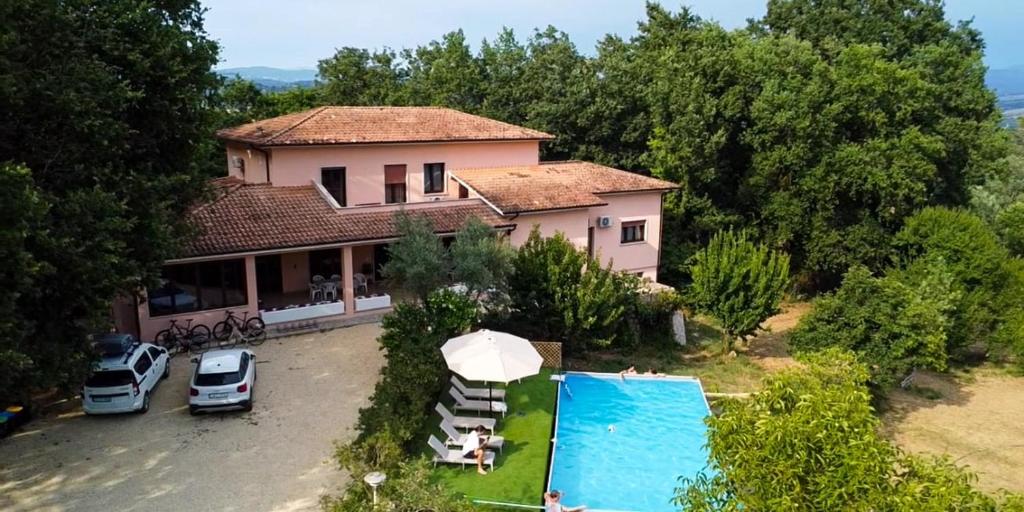 an aerial view of a house with a swimming pool at Villa with Garden near Rome for Groups & Families in Orte