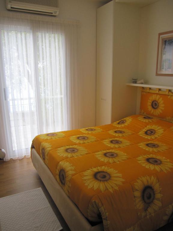 Łóżko lub łóżka w pokoju w obiekcie Villa Itati