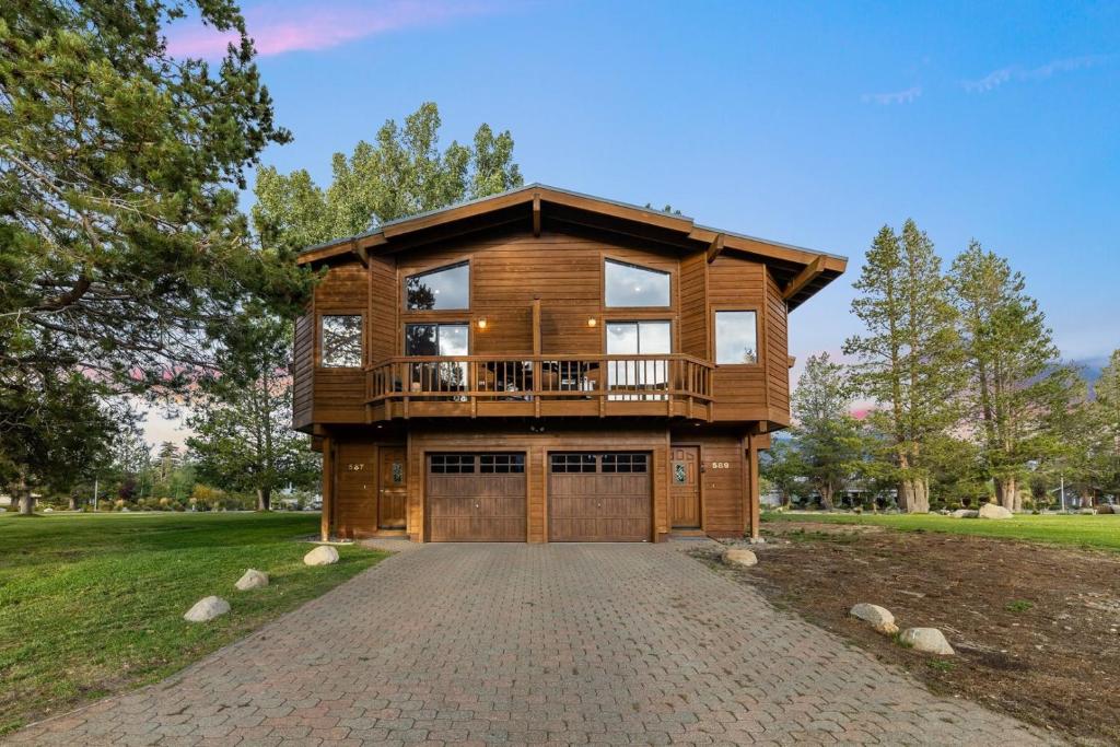 a large wooden house with a balcony on a driveway at 587 Danube Drive condo in Lake Valley