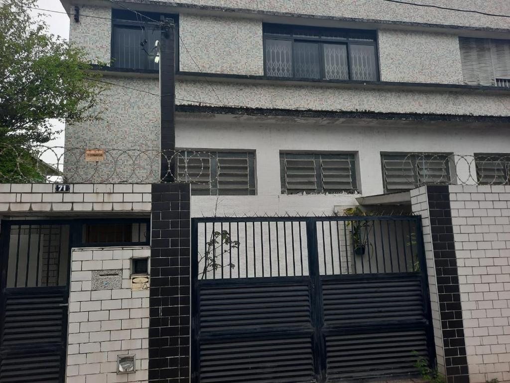 a house with a gate in front of it at Vila Hostel Santos in Santos