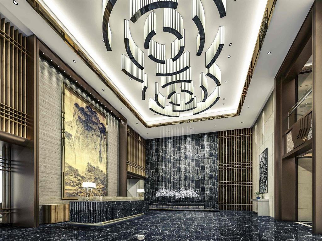 a lobby of a hotel with a chandelier at Mercure Chongqing Downtown in Chongqing