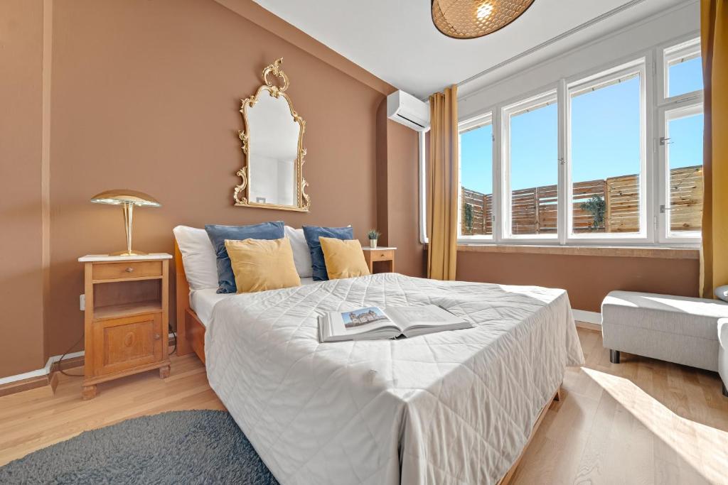 a bedroom with a bed and a mirror on the wall at Waterfront River Side Roof Top Apartment - Terrace with city view in Prague