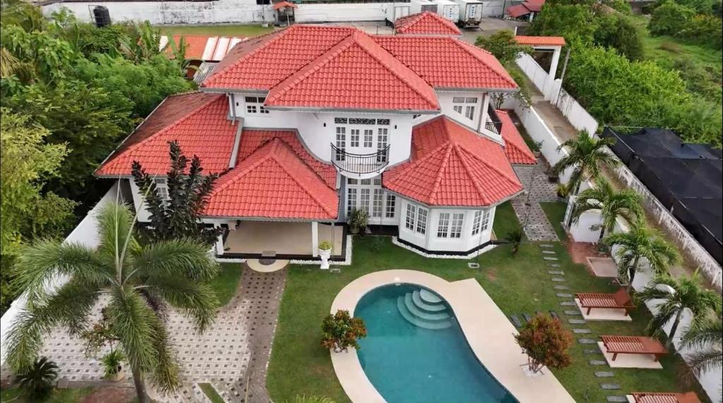 an aerial view of a house with red roofs at Cs white house negombo in Negombo