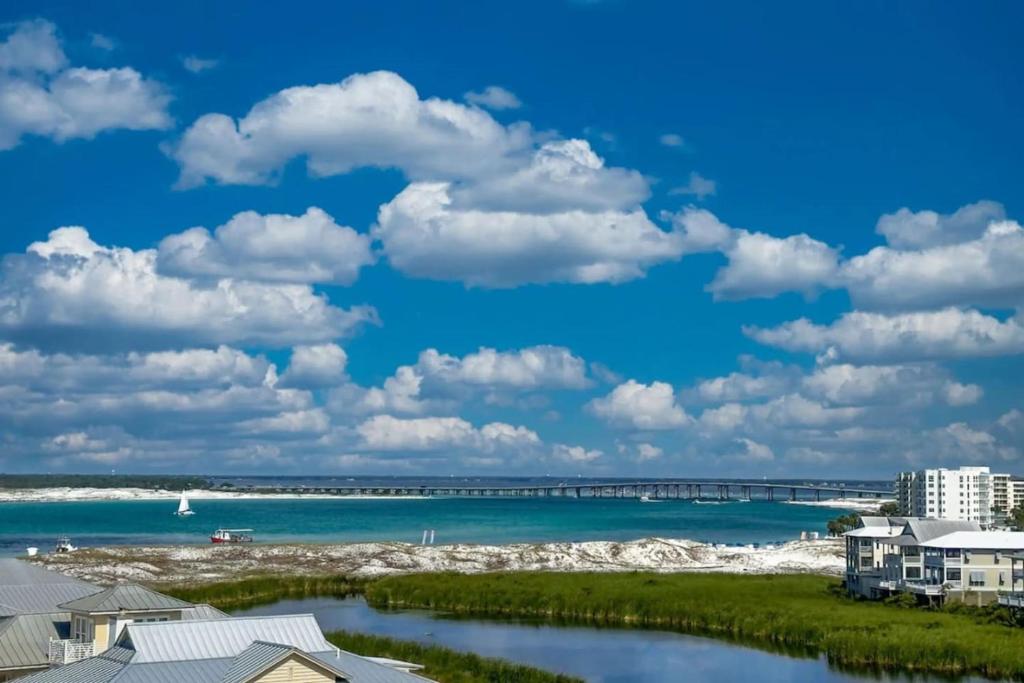a view of the beach with a bridge in the water at Jetty East, Paradise Palms, Sleeps 4, Pool Private Beach in Destin