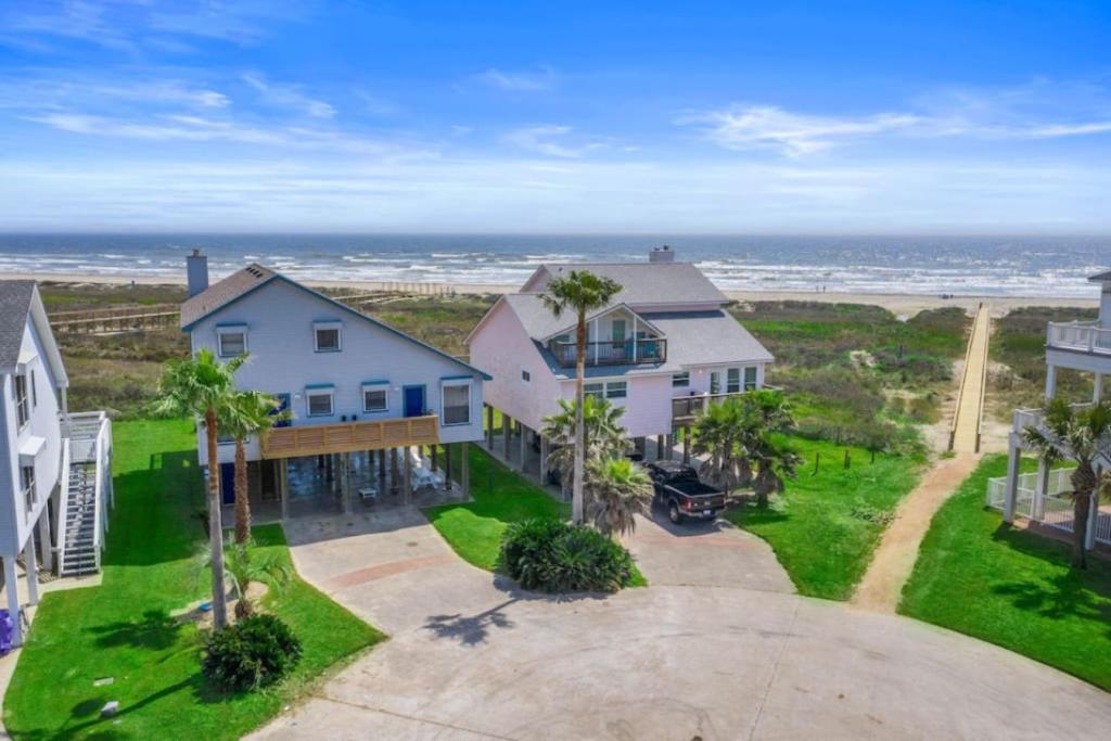 an aerial view of a house with the ocean in the background at Secluded beachfront house with gorgeous ocean views in Galveston