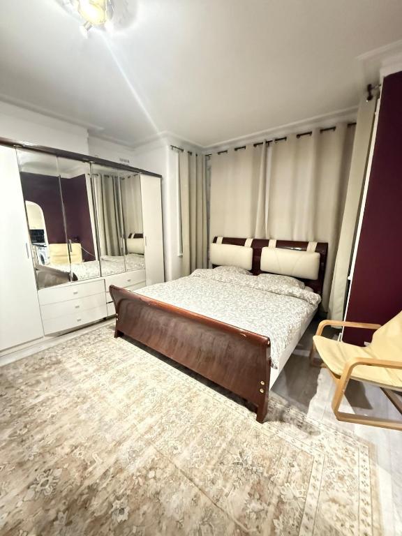 a bedroom with a bed and a large window at Cozy Flat near Harrow-on-the-Hill Station in Harrow