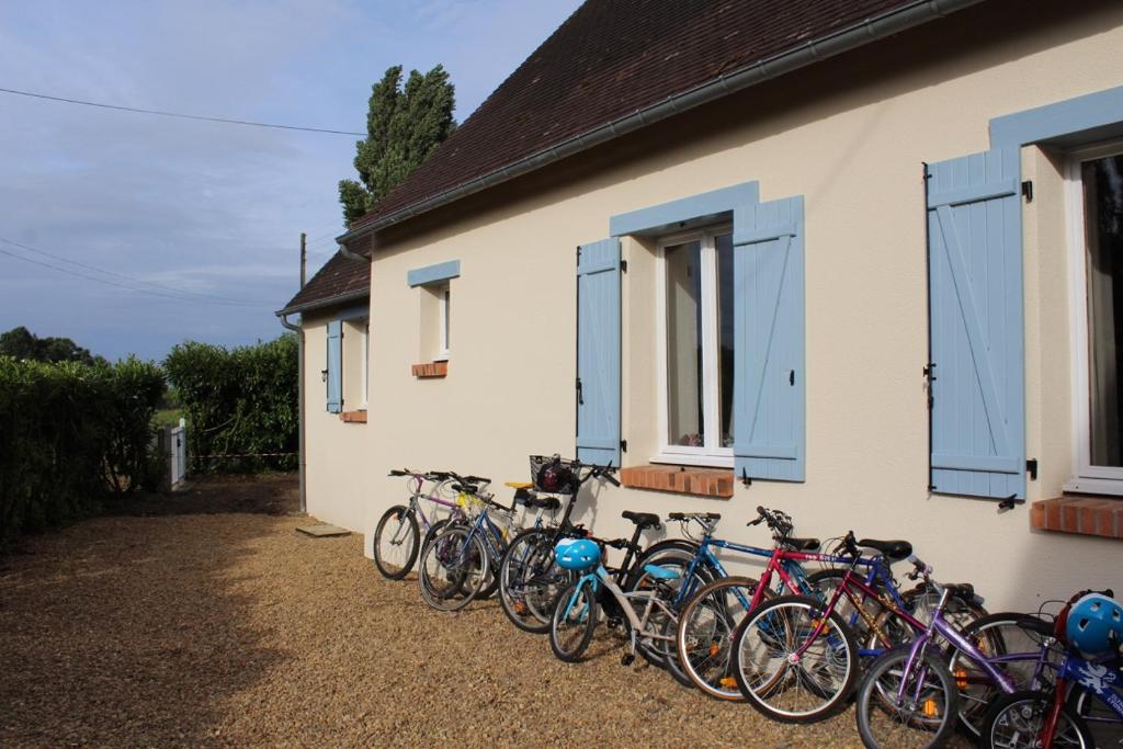 a group of bikes parked outside of a house at Fleur House in Teloché