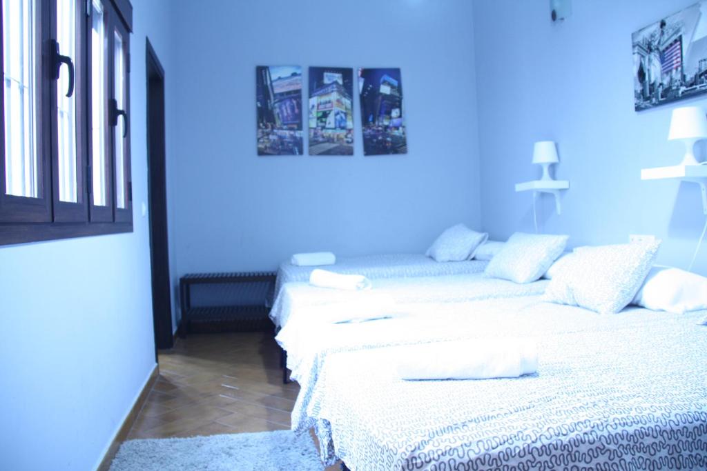 Posteľ alebo postele v izbe v ubytovaní Casa Sevilla Nervión-Centro