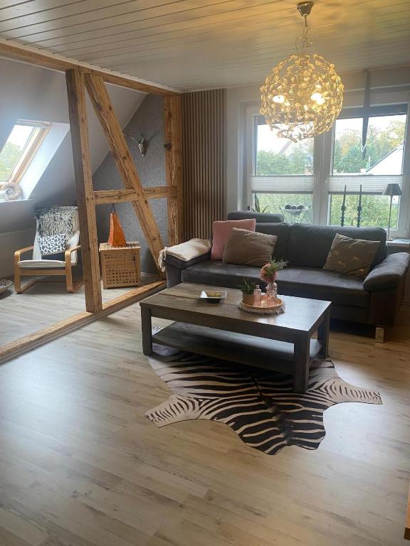 a living room with a couch and a coffee table at Haus Sommerfeld in Gültz