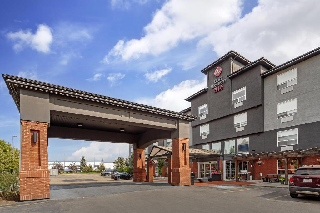 a rendering of a hotel with a parking lot at Best Western Plus West Edmonton in Edmonton