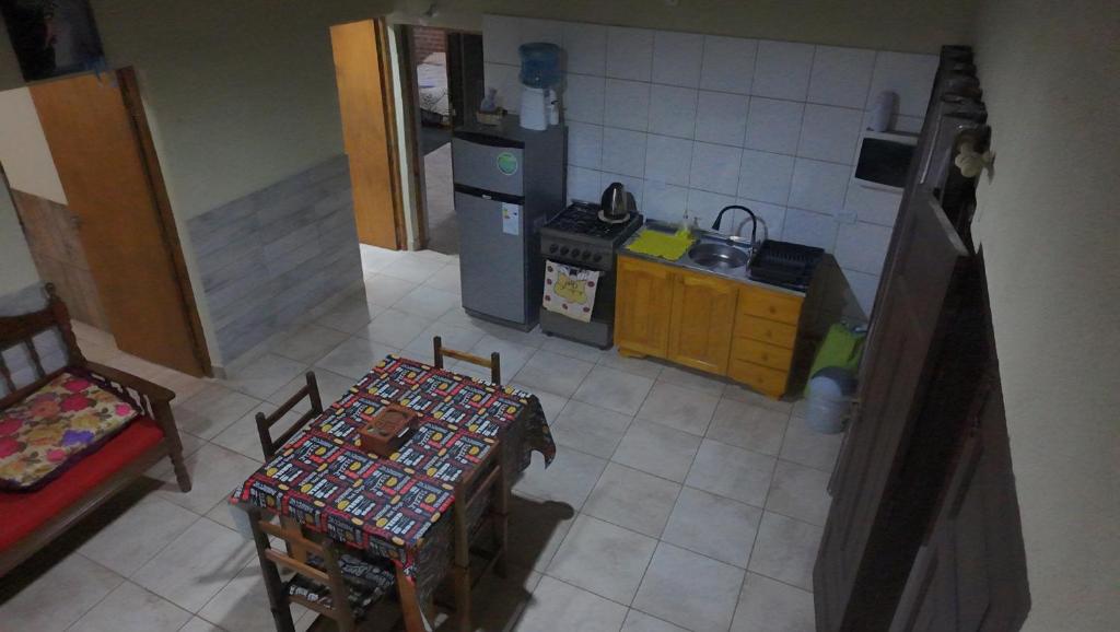 an aerial view of a kitchen with a table and chairs at La Reina in Eldorado