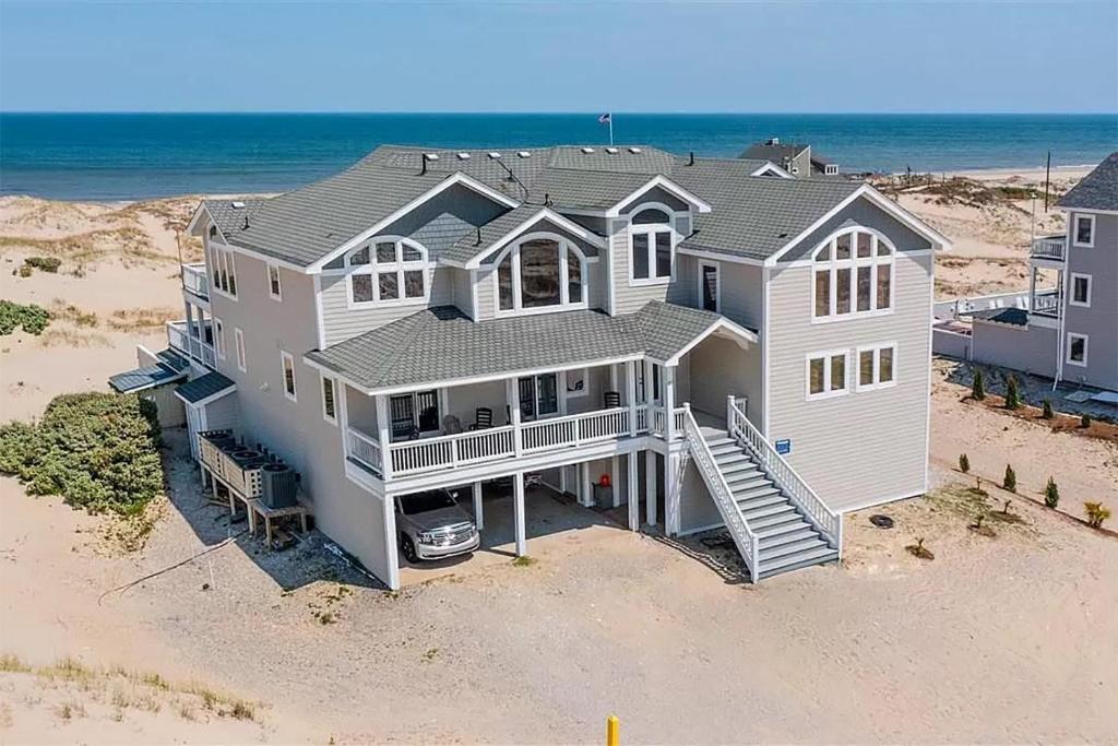 an aerial view of a house on the beach at C9703 Oceanfront Luxury Retreat in Carova, Private Pool & Hot Tub - Prices Reduced! in Corolla
