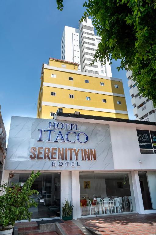 a hotel taez serenity inn hotel with buildings in the background at Hotel Serenity Inn in Cartagena de Indias