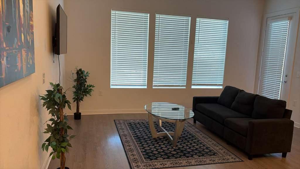 a living room with a couch and a table at Modern Leander Getaway Near Shop- Leander TX in Leander