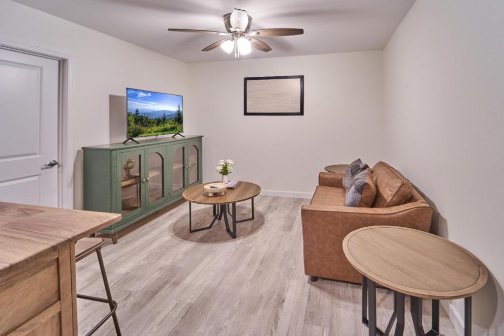 a living room with a couch and a table at The Ruby 309 By Avada Properties in Pigeon Forge