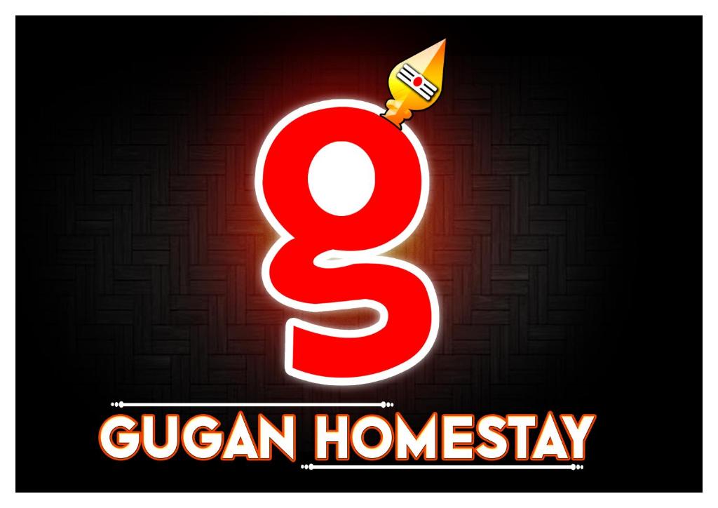 a neon sign that saysguan homay with a candle at Gugan home stay in Tiruchchendūr