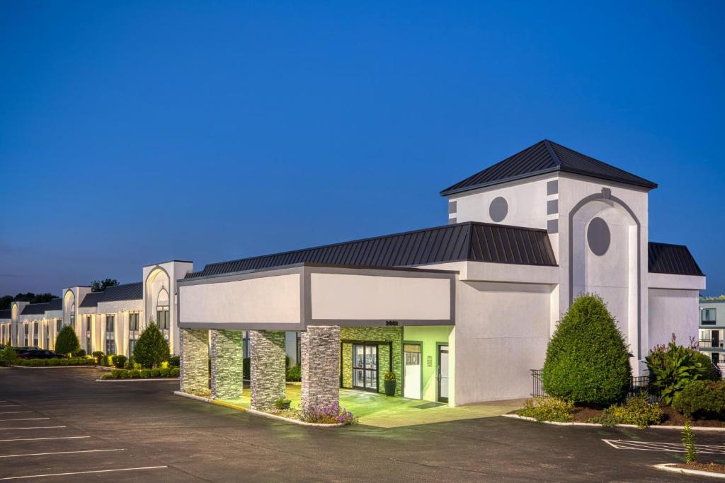 a large white building with a black roof at Best Western Greensboro Coliseum Inn in Greensboro