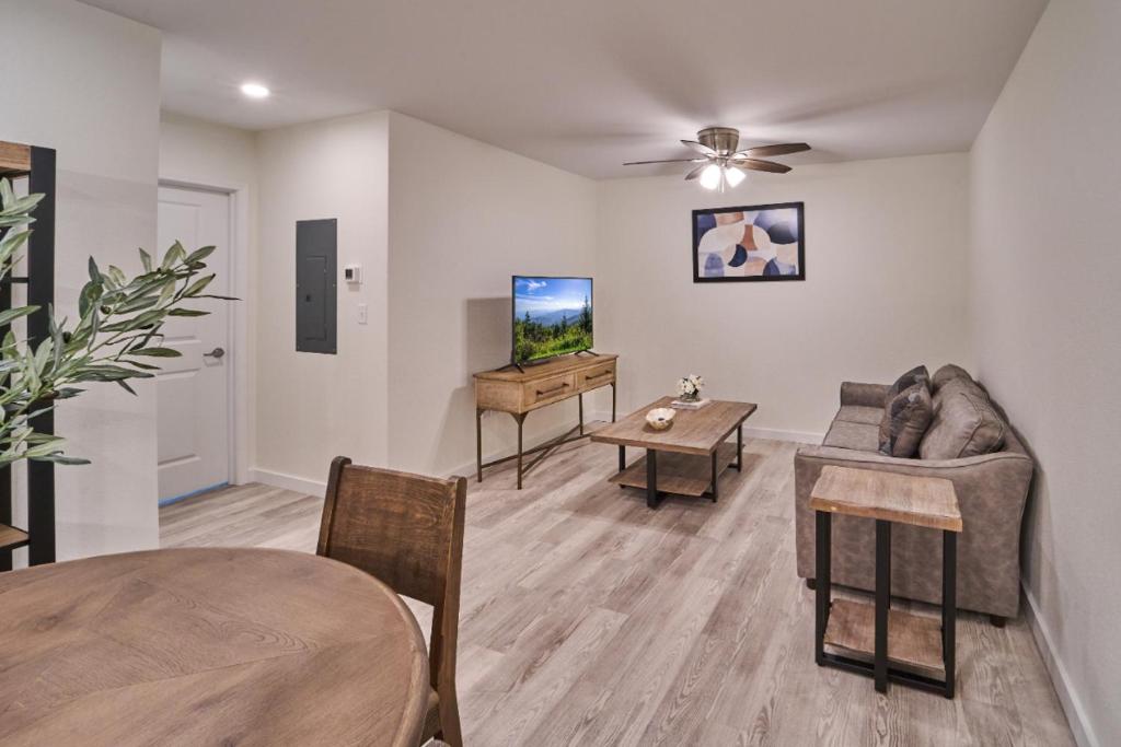 a living room with a couch and a table at The Ruby 315 By Avada Properties in Pigeon Forge