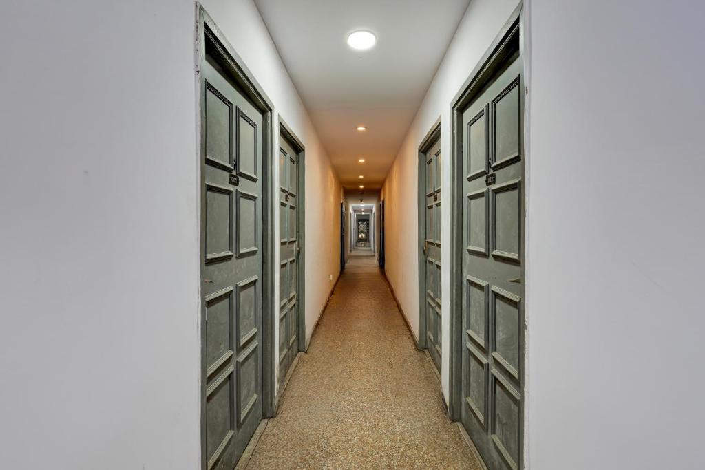 a corridor with doors in a hallway at Collection O Singha Crossway Formerly Hotel Star Key in Gurgaon