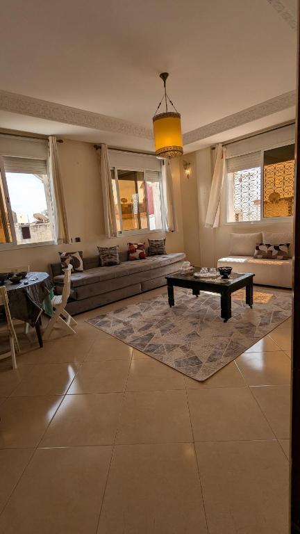 a living room with a couch and a table at city centre house Near to souk Elhad agadir in Agadir