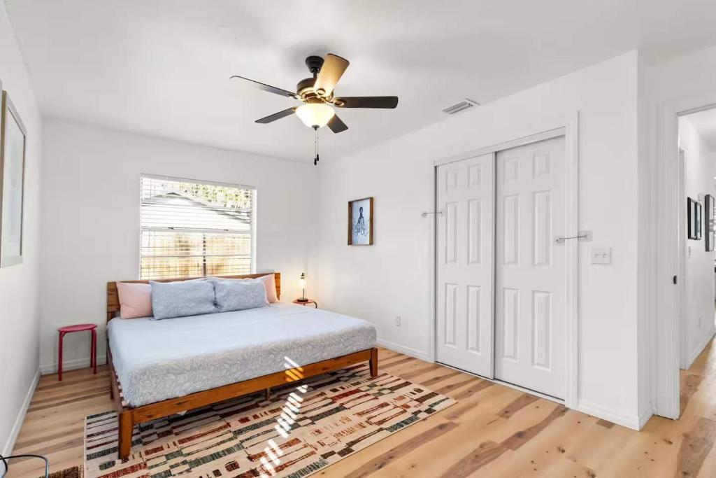a bedroom with a bed and a ceiling fan at Pet Friendly Crystal River Retreat for the Family in Crystal River