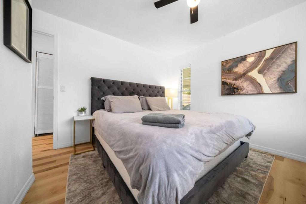 a bedroom with a large bed in a white room at Drift & Dream Getaway Relax After Your Adventure with your Family in Crystal River