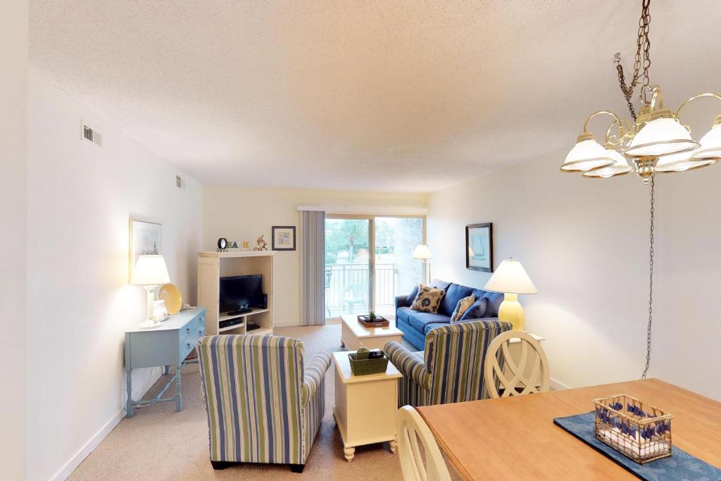 a living room with a couch and a table at Bluff Villas 1733 in Hilton Head Island