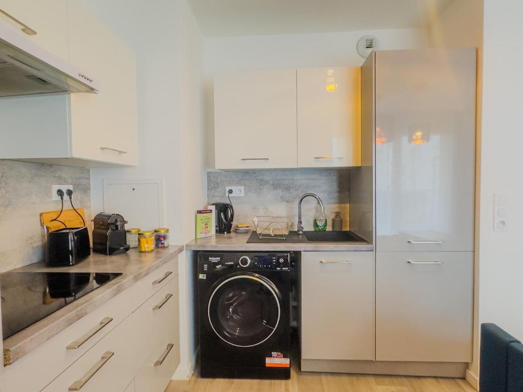 Η κουζίνα ή μικρή κουζίνα στο Le Cosy Chic - F2