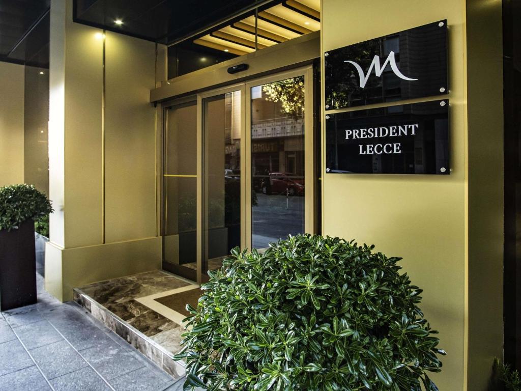 a building with a sign on the front of it at Mercure Hotel President Lecce in Lecce