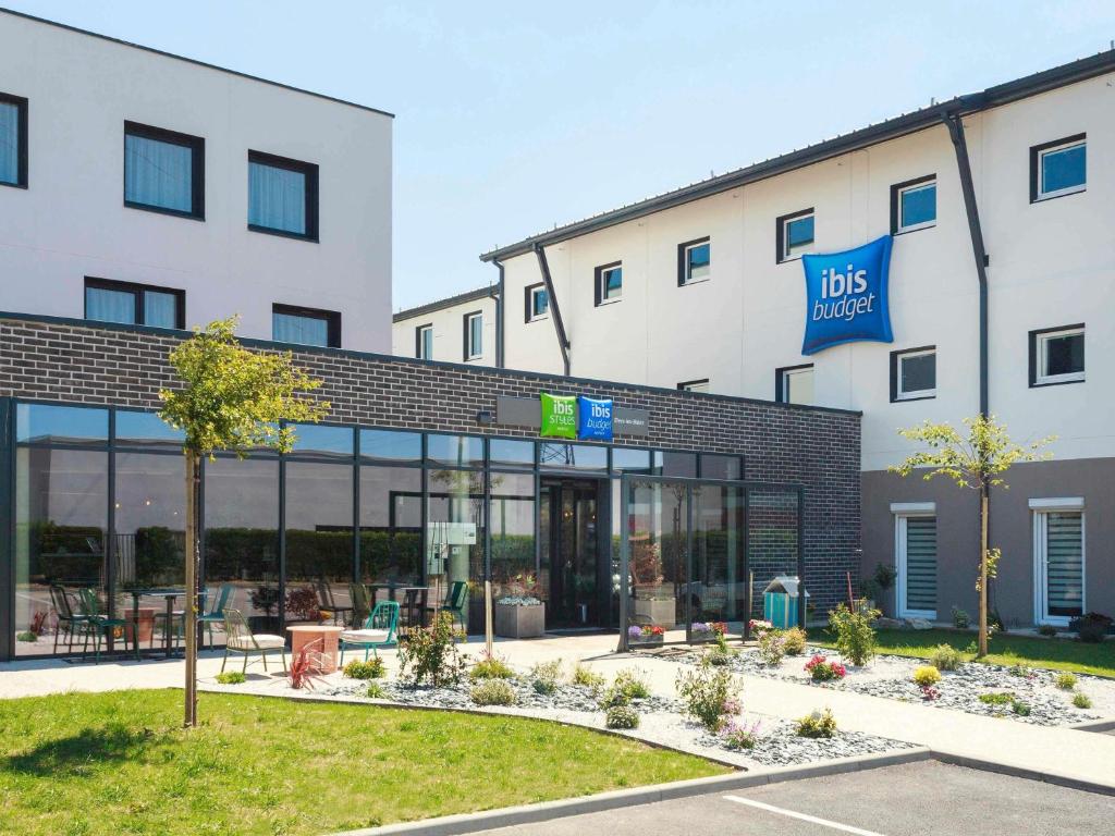 a building with a ups label sign in front of it at ibis Budget Le Treport Mers Les Bains in Mers-les-Bains