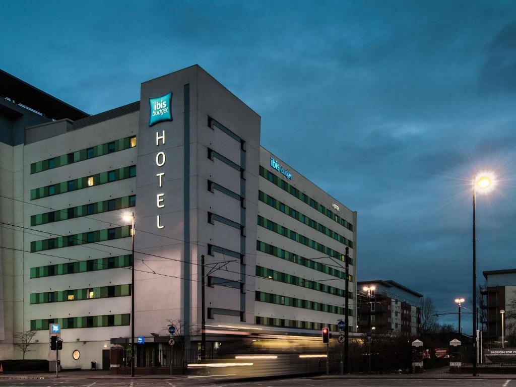 a building with a sign on the side of it at ibis budget Manchester Salford Quays in Manchester