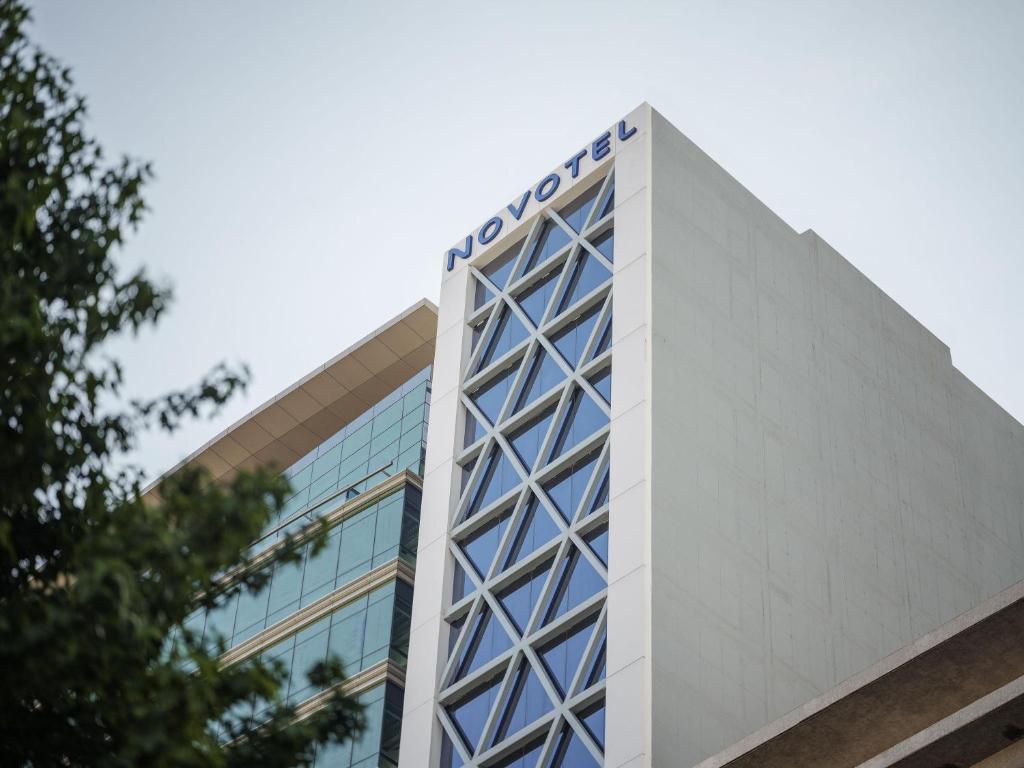 a building with a scientology sign on top of it at Novotel Mexico City World Trade Center in Mexico City