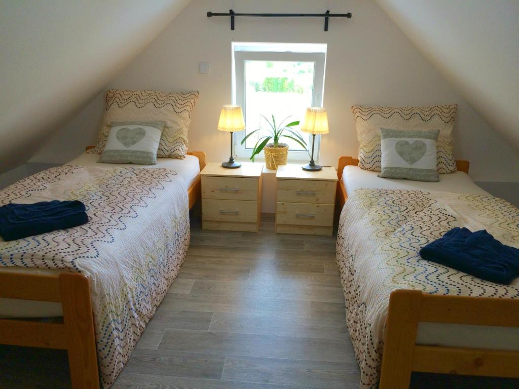 Postel nebo postele na pokoji v ubytování Apartmány U Ořecha