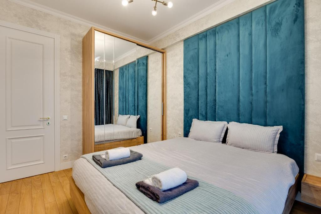 Postel nebo postele na pokoji v ubytování Hilton Suite Apartment Tbilisi