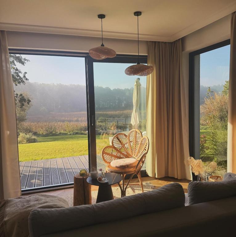 a living room with a couch and a large window at Swobodna 6 in Swobodna