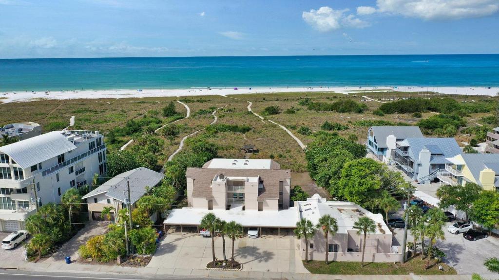 an aerial view of a building and the beach at Siesta Sunset - 524 (PH) in Siesta Key